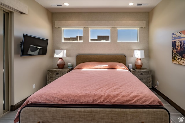 5024 W Nashoba Trl Unit 74, Hurricane, UT 84737 - bedroom featuring baseboards, recessed lighting, visible vents, and wood finished floors