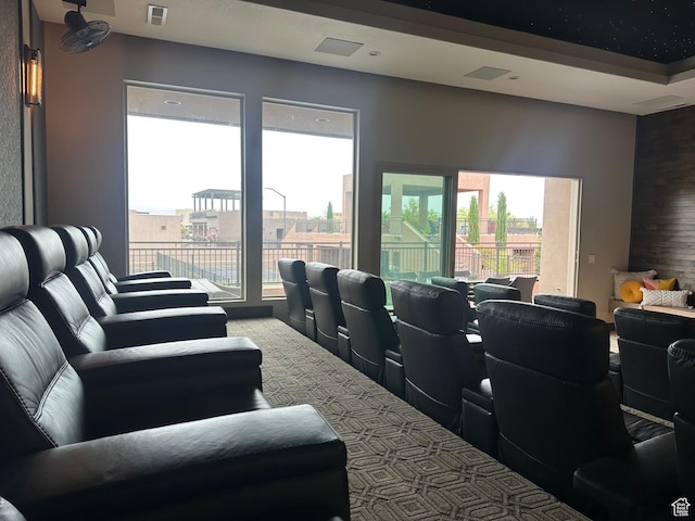 5024 W Nashoba Trl Unit 74, Hurricane, UT 84737 - carpeted cinema room featuring a wealth of natural light and visible vents