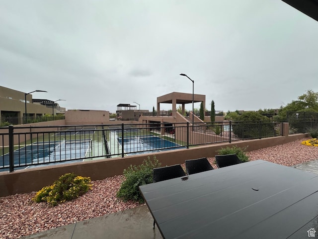 5024 W Nashoba Trl Unit 74, Hurricane, UT 84737 - view of swimming pool with a swimming pool, a patio, and fence