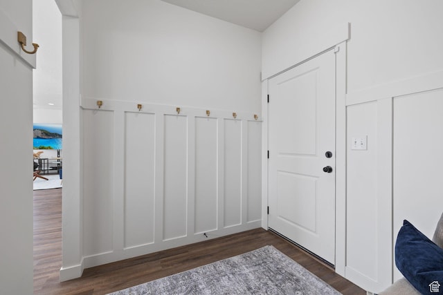988 E Harrier St N, Eagle Mountain, UT 84005 - doorway featuring wainscoting, a decorative wall, and dark wood-style flooring