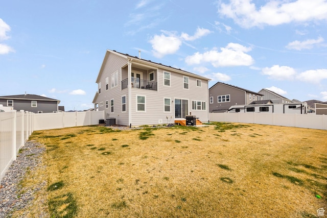 988 E Harrier St N, Eagle Mountain, UT 84005 - back of property featuring a balcony, cooling unit, a fenced backyard, and a yard