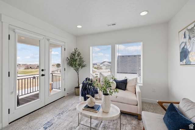 988 E Harrier St N, Eagle Mountain, UT 84005 - living room with recessed lighting, french doors, carpet, baseboards, and visible vents