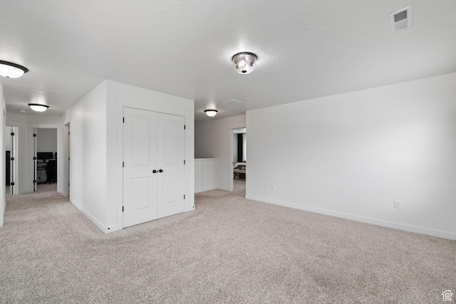 988 E Harrier St N, Eagle Mountain, UT 84005 - spare room featuring baseboards, visible vents, carpet, and a textured ceiling