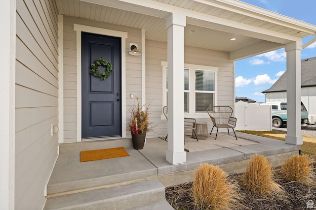 988 E Harrier St N, Eagle Mountain, UT 84005 - view of exterior entry with covered porch and fence