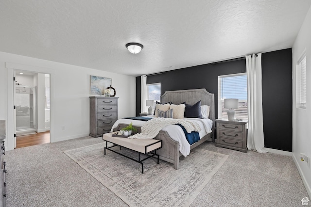 988 E Harrier St N, Eagle Mountain, UT 84005 - bedroom with connected bathroom, baseboards, carpet, and a textured ceiling
