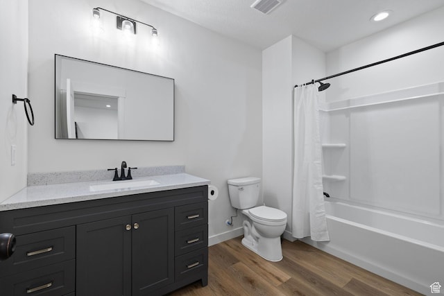 988 E Harrier St N, Eagle Mountain, UT 84005 - bathroom featuring vanity, toilet, visible vents, shower / bath combo, and wood finished floors