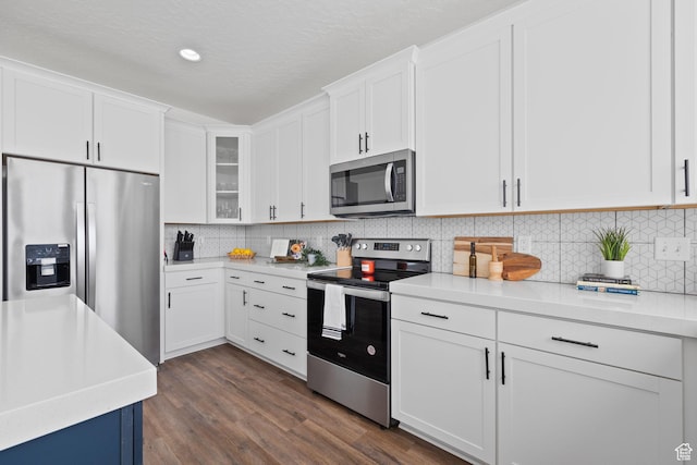988 E Harrier St N, Eagle Mountain, UT 84005 - kitchen with white cabinetry, light countertops, dark wood-type flooring, and stainless steel appliances