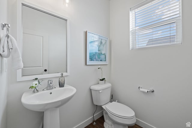 988 E Harrier St N, Eagle Mountain, UT 84005 - bathroom featuring baseboards, toilet, a sink, and wood finished floors