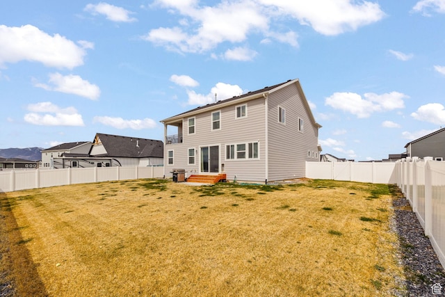 988 E Harrier St N, Eagle Mountain, UT 84005 - back of house featuring a yard, a fenced backyard, and entry steps