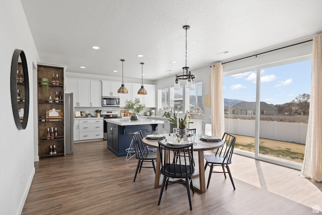 988 E Harrier St N, Eagle Mountain, UT 84005 - dining space with a textured ceiling, baseboards, recessed lighting, dark wood-type flooring, and an inviting chandelier