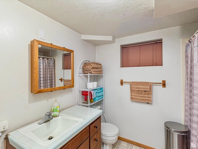 850 W 370 S, Logan, UT 84321 - full bathroom featuring toilet, vanity, a textured ceiling, and curtained shower