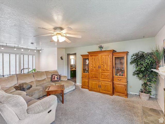 850 W 370 S, Logan, UT 84321 - living area with ceiling fan, a textured ceiling, light colored carpet, and baseboards