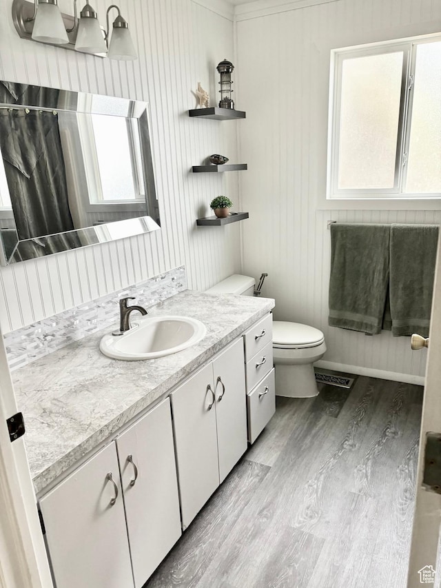 850 W 370 S, Logan, UT 84321 - bathroom featuring toilet, wood finished floors, vanity, and curtained shower