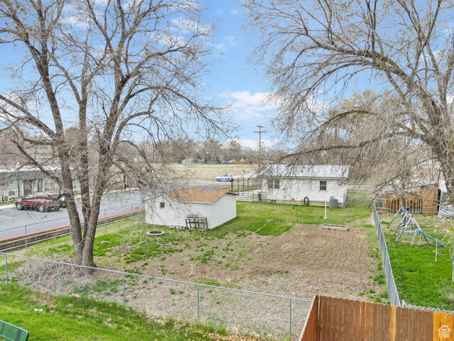 510 S Grant E, Ogden, UT 84404 - view of yard with a fenced backyard and an outdoor structure