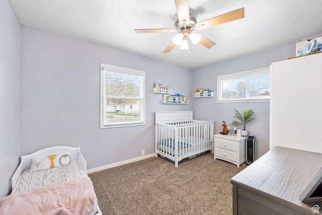 510 S Grant E, Ogden, UT 84404 - carpeted bedroom with a nursery area, baseboards, a textured ceiling, and a ceiling fan