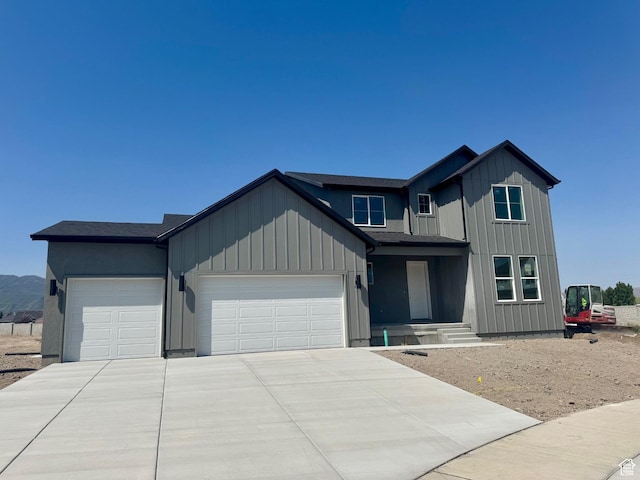 1002 E 250th St S Unit 17, Salem, UT 84653 - modern farmhouse style home featuring an attached garage, concrete driveway, and board and batten siding