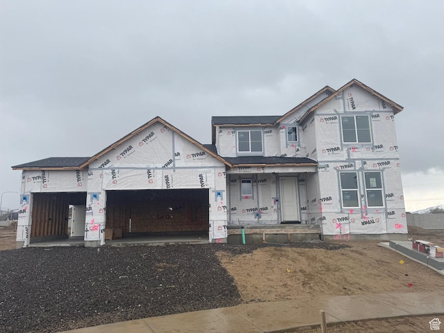 unfinished property featuring a garage