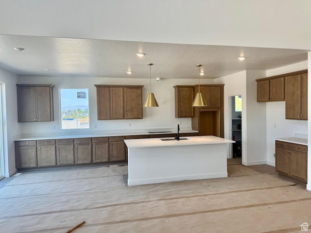 1002 E 250th St S Unit 17, Salem, UT 84653 - kitchen with a center island with sink, decorative light fixtures, a textured ceiling, recessed lighting, and light countertops
