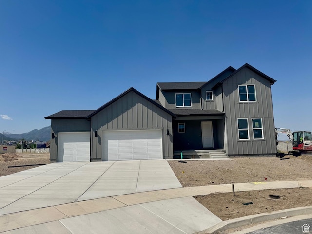1002 E 250th St S Unit 17, Salem, UT 84653 - view of front of property with a garage, driveway, and board and batten siding