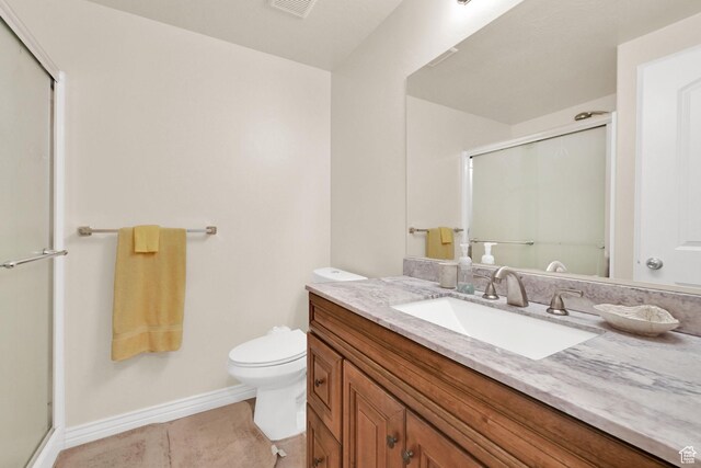 6007 W Jargon Way, Salt Lake City, UT 84118 - full bathroom featuring tile patterned floors, toilet, vanity, a shower stall, and baseboards