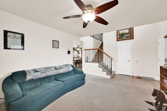 6007 W Jargon Way, Salt Lake City, UT 84118 - carpeted living room featuring baseboards, ceiling fan, and stairway