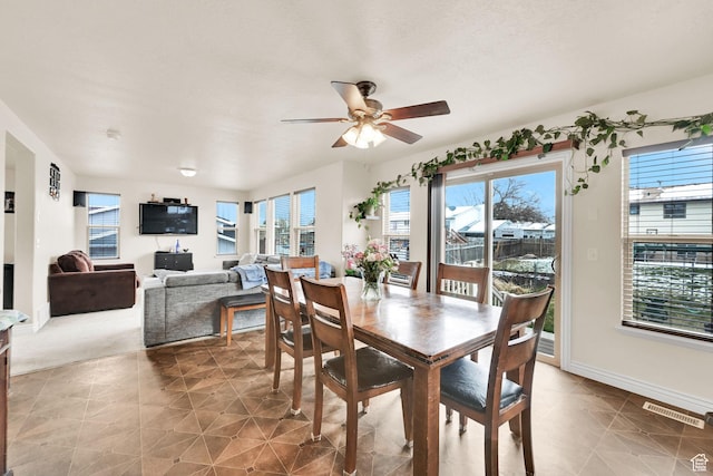 6007 W Jargon Way, Salt Lake City, UT 84118 - tiled dining area with baseboards, visible vents, and ceiling fan