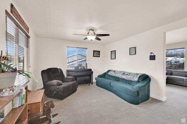 6007 W Jargon Way, Salt Lake City, UT 84118 - living room with baseboards, carpet floors, and a ceiling fan