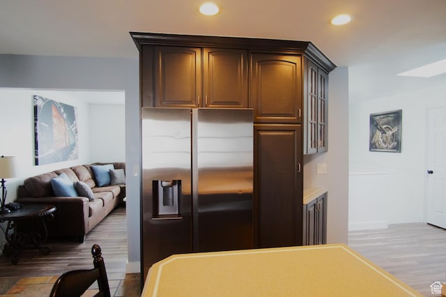 7598 S 2290 W, West Jordan, UT 84084 - kitchen with stainless steel fridge with ice dispenser, wood finished floors, recessed lighting, glass insert cabinets, and open floor plan