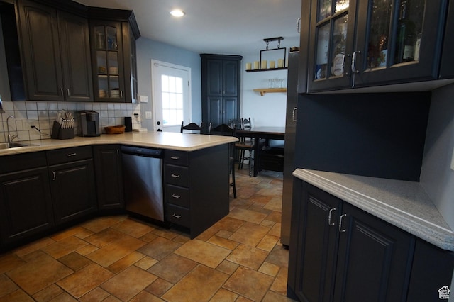 7598 S 2290 W, West Jordan, UT 84084 - kitchen featuring dishwasher, light countertops, tasteful backsplash, a peninsula, and recessed lighting