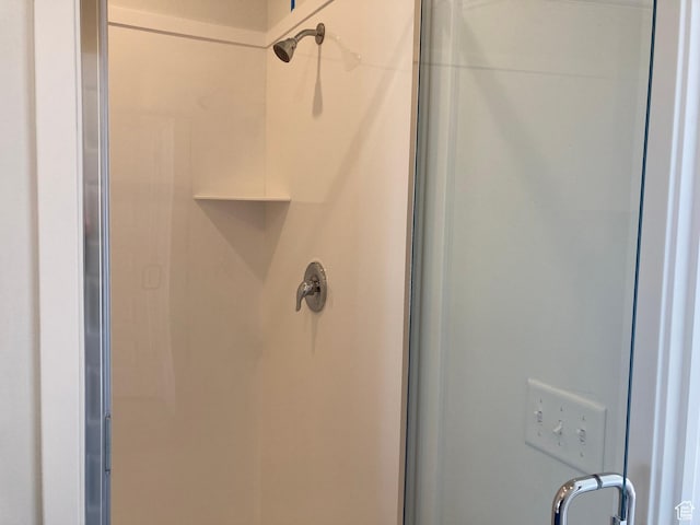 bathroom featuring a shower stall
