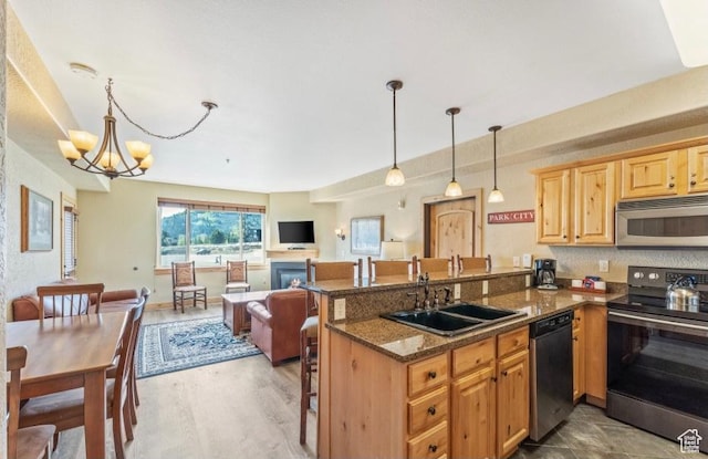 2669 Canyons Resort Dr Unit 312, Park City, UT 84098 - kitchen featuring a chandelier, a peninsula, appliances with stainless steel finishes, a sink, and open floor plan