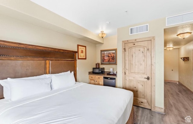 2669 Canyons Resort Dr Unit 312, Park City, UT 84098 - bedroom with baseboards, visible vents, and wood finished floors