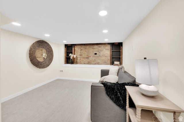 sitting room with carpet flooring, baseboards, and recessed lighting
