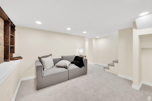 carpeted living room featuring baseboards, recessed lighting, and stairway