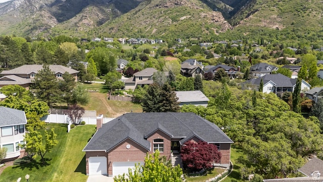 aerial perspective of suburban area with a mountainous background