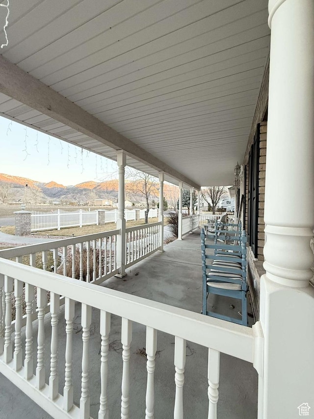 wooden deck with a mountain view