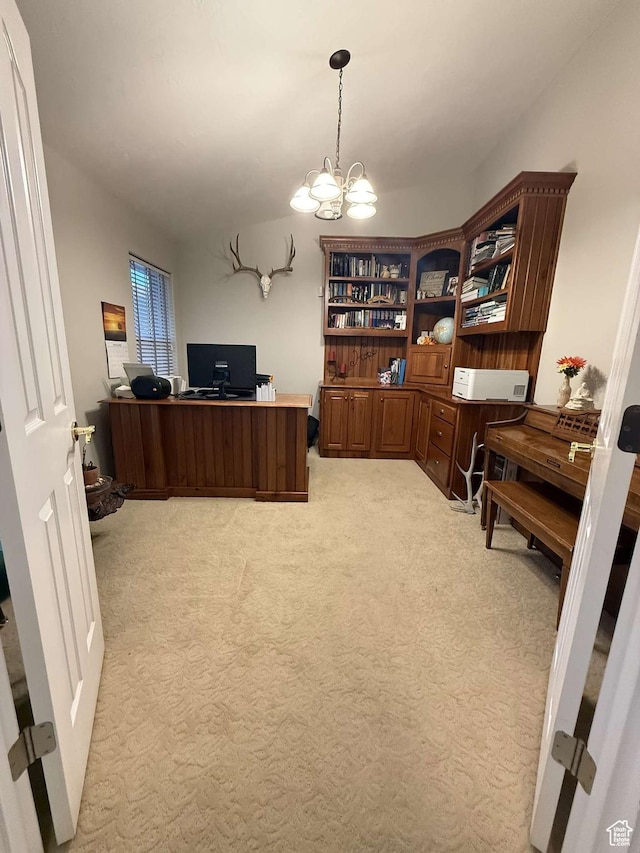 office space with light colored carpet and an inviting chandelier