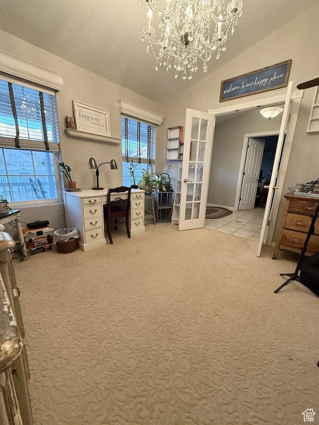 office featuring a healthy amount of sunlight, carpet, a chandelier, and lofted ceiling