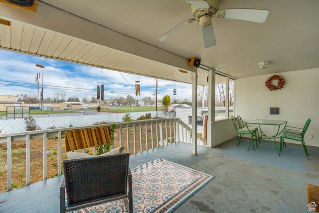 1055 E Chevy Chase Dr S, Murray, UT 84117 - view of patio with fence, outdoor dining space, a ceiling fan, an outdoor structure, and a shed