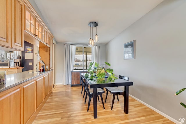 1055 E Chevy Chase Dr S, Murray, UT 84117 - dining area with baseboards and light wood-style floors