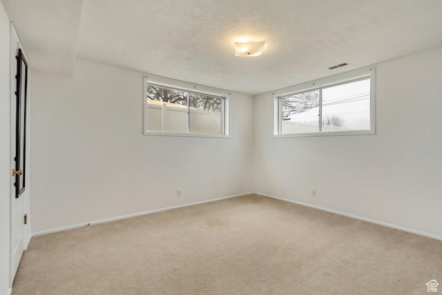 1055 E Chevy Chase Dr S, Murray, UT 84117 - spare room with light carpet, baseboards, visible vents, and a textured ceiling
