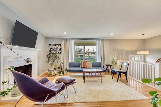 1055 E Chevy Chase Dr S, Murray, UT 84117 - living room featuring a tiled fireplace, wood finished floors, and recessed lighting