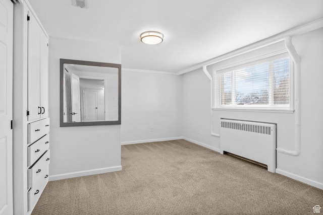 2928 S 575 W, Bountiful, UT 84010 - unfurnished bedroom featuring radiator heating unit, baseboards, carpet flooring, and crown molding