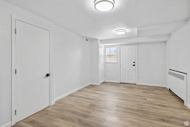 2928 S 575 W, Bountiful, UT 84010 - entrance foyer with radiator, baseboards, and light wood finished floors