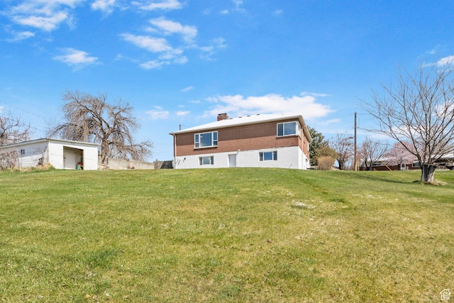 2928 S 575 W, Bountiful, UT 84010 - rear view of property with brick siding, a yard, and a chimney