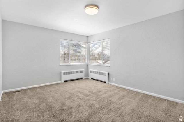 2928 S 575 W, Bountiful, UT 84010 - spare room with radiator, carpet floors, and visible vents
