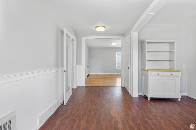 2928 S 575 W, Bountiful, UT 84010 - corridor with dark wood finished floors, arched walkways, visible vents, and baseboards