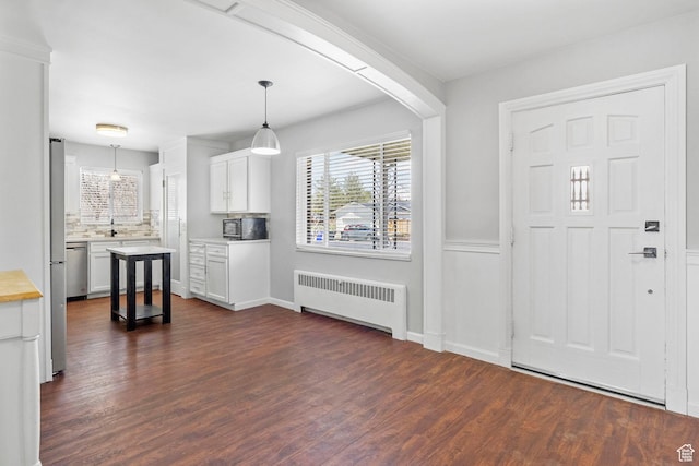 2928 S 575 W, Bountiful, UT 84010 - entryway featuring dark wood-style flooring and radiator heating unit