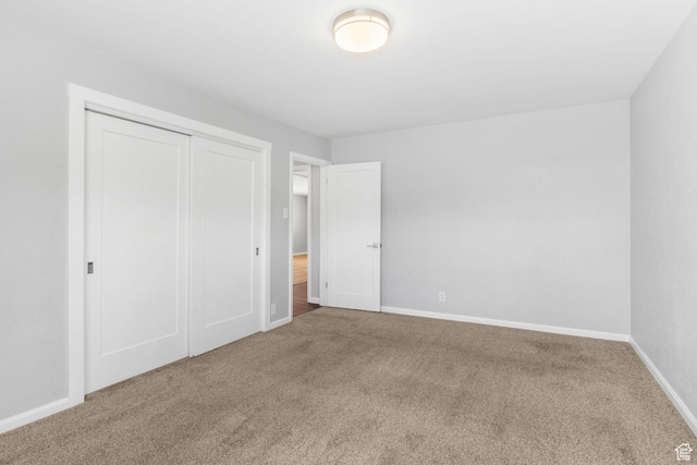 2928 S 575 W, Bountiful, UT 84010 - unfurnished bedroom featuring baseboards, a closet, and carpet