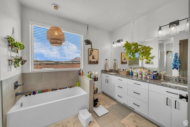 687 S Guy Ln Unit 1, Ivins, UT 84738 - bathroom with a bath, double vanity, a sink, and tile patterned floors